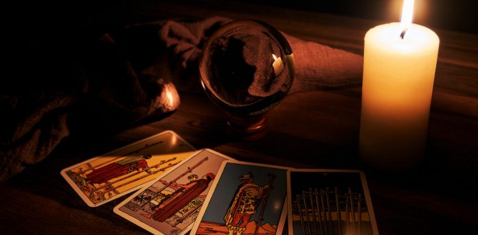 tarot cards by candle light